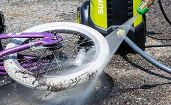 Pressure Washer has been used to clean a bicycle.