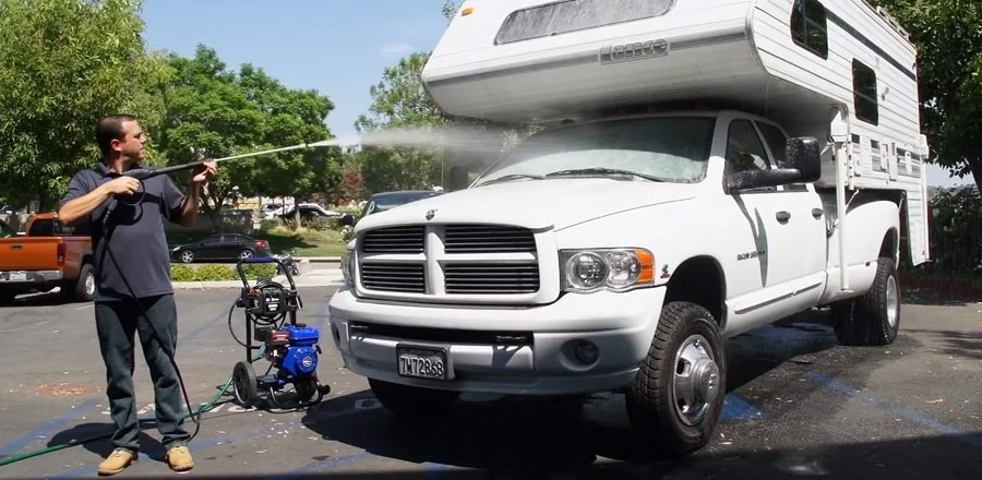 Man washes his van.